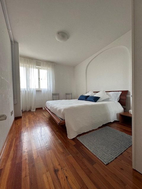 Second bright bedroom of the seafront apartment in Grado