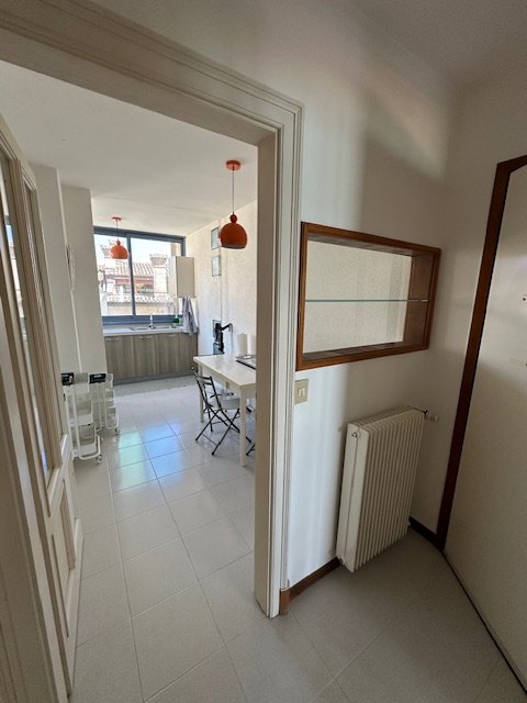 Kitchenette and dining area of the apartment in Grado